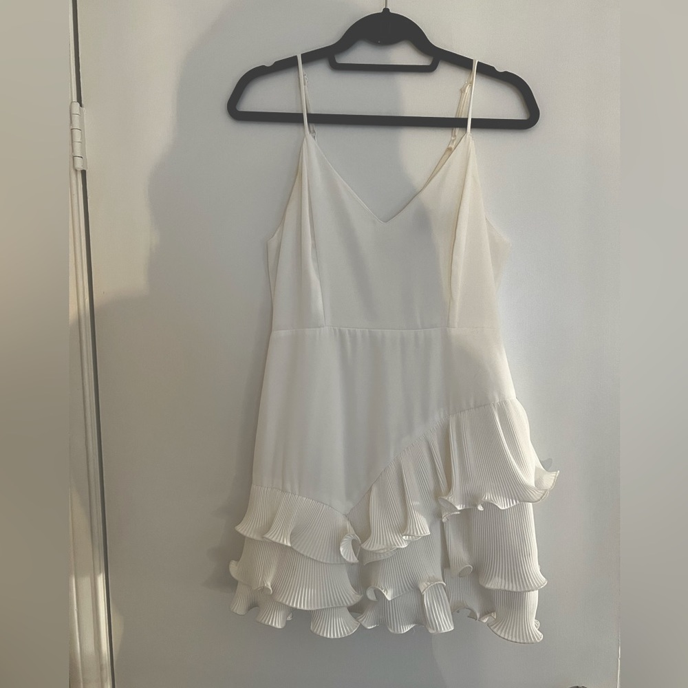 White dress with fun details at bottom. Worn once- like new condition.
